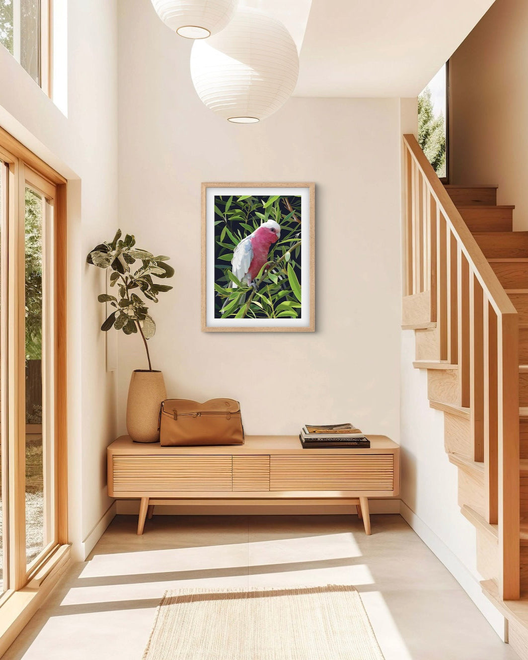 Modern interior with a pink cockatoo painting on the wall, wooden bench, and staircase.